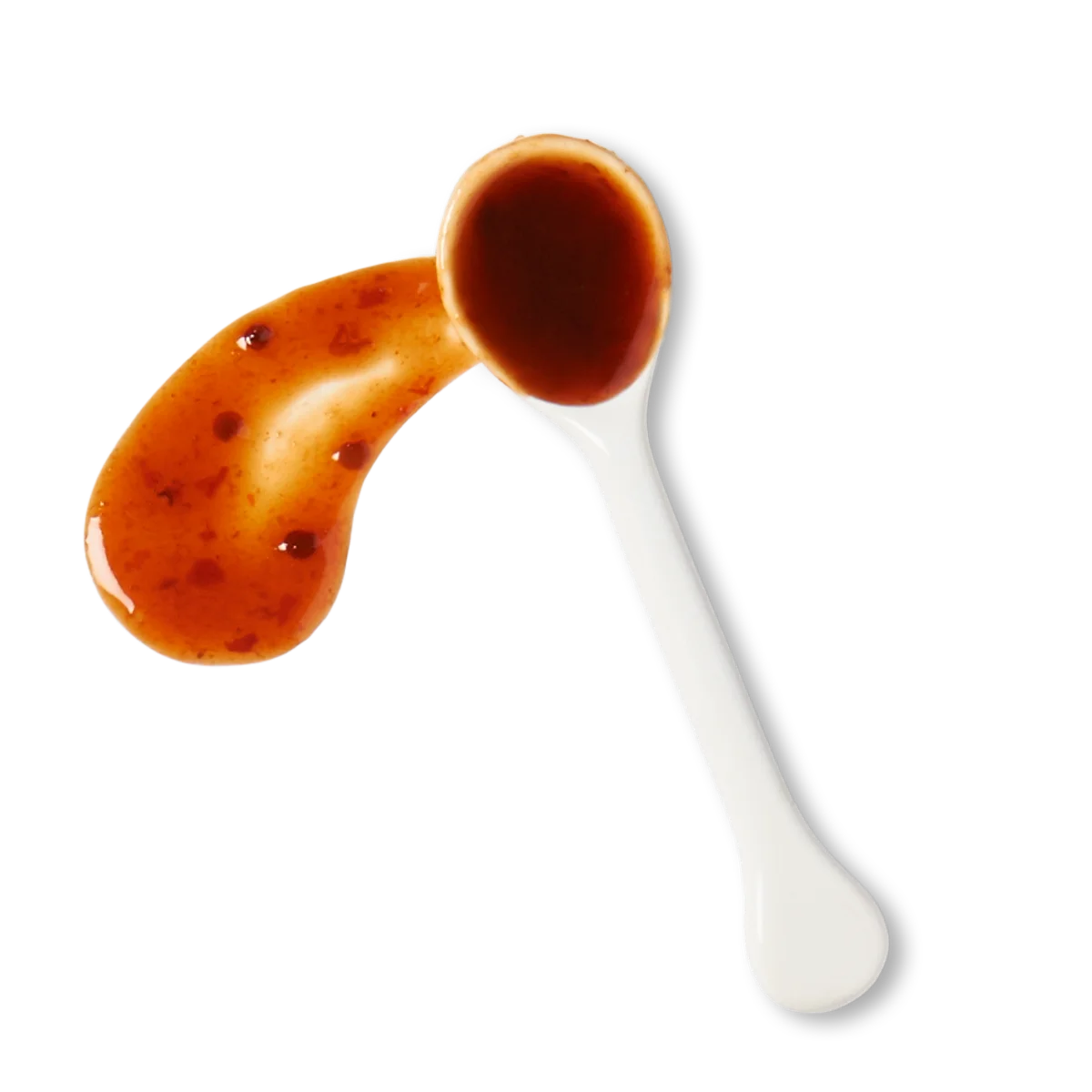 A white spoon with a reddish-brown sauce, with some sauce spilled next to the spoon on a white background.