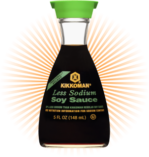 A bottle of Kikkoman Less Sodium Soy Sauce, 5 fl oz (148 ml), with a green cap and orange rays in the background.