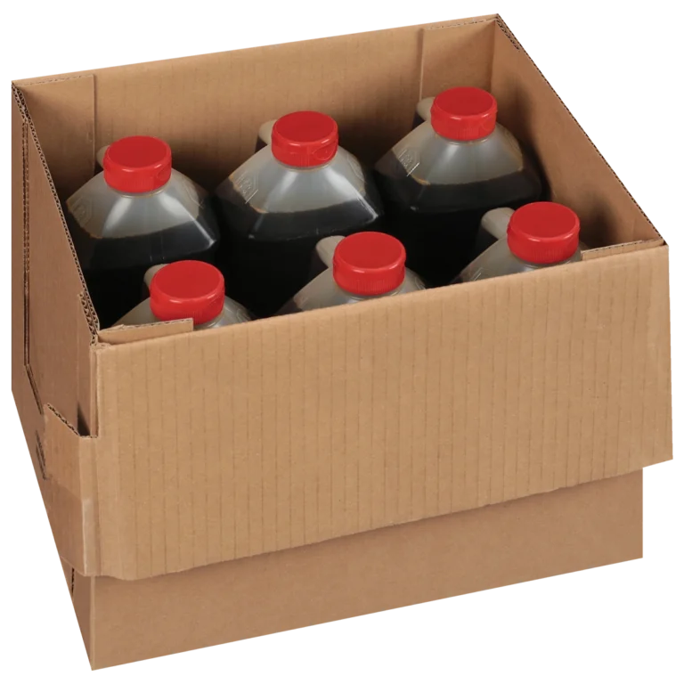 A cardboard box containing six large plastic bottles with red caps, filled with a dark liquid.