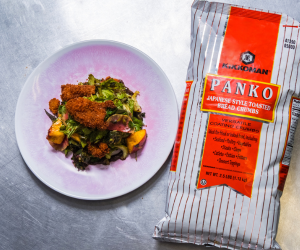 Collard Green Salad topped with crispy chicken skins coated in Kikkoman® Panko Bread Crumbs.