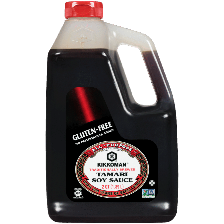 A 2-quart plastic bottle of Kikkoman All-Purpose Tamari Soy Sauce with a red cap, labeled gluten-free.