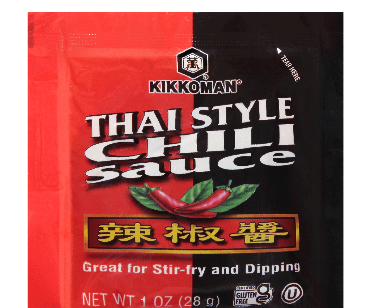 A packet of Kikkoman Thai Style Chili Sauce featuring images of red chili peppers and text stating it's great for stir-fry and dipping.