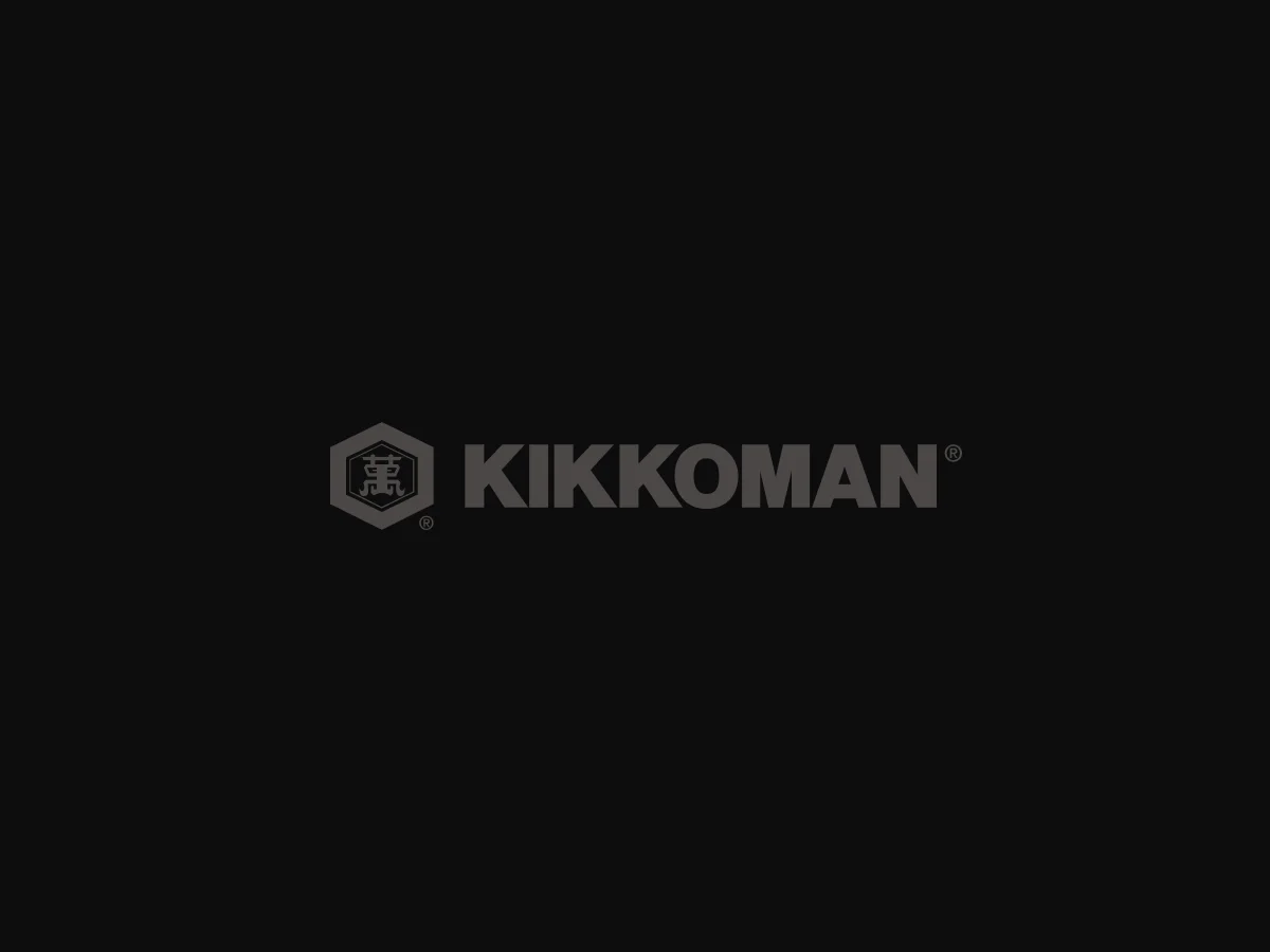 The Kikkoman logo with hexagonal emblem and stylized text appears centered on a solid black background.