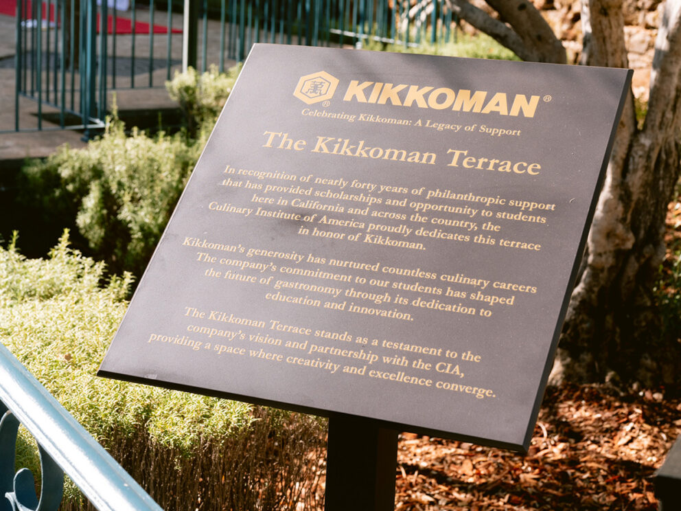 A plaque titled "The Kikkoman Terrace" describes the company's philanthropic support to the Culinary Institute of America and its dedication to culinary education and excellence.