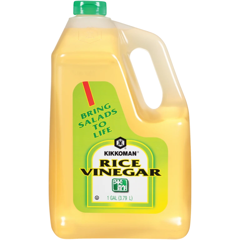 A one-gallon plastic jug of Kikkoman Rice Vinegar with a green cap.