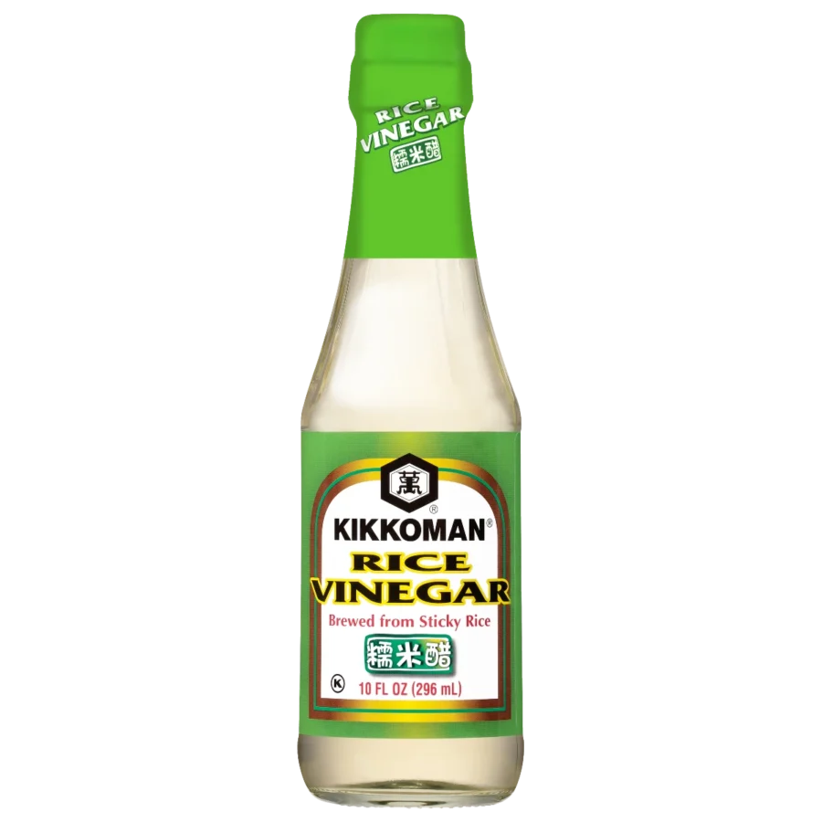 A 10 fl oz (296 mL) bottle of Kikkoman rice vinegar with a green cap and label, showing it is brewed from sticky rice.