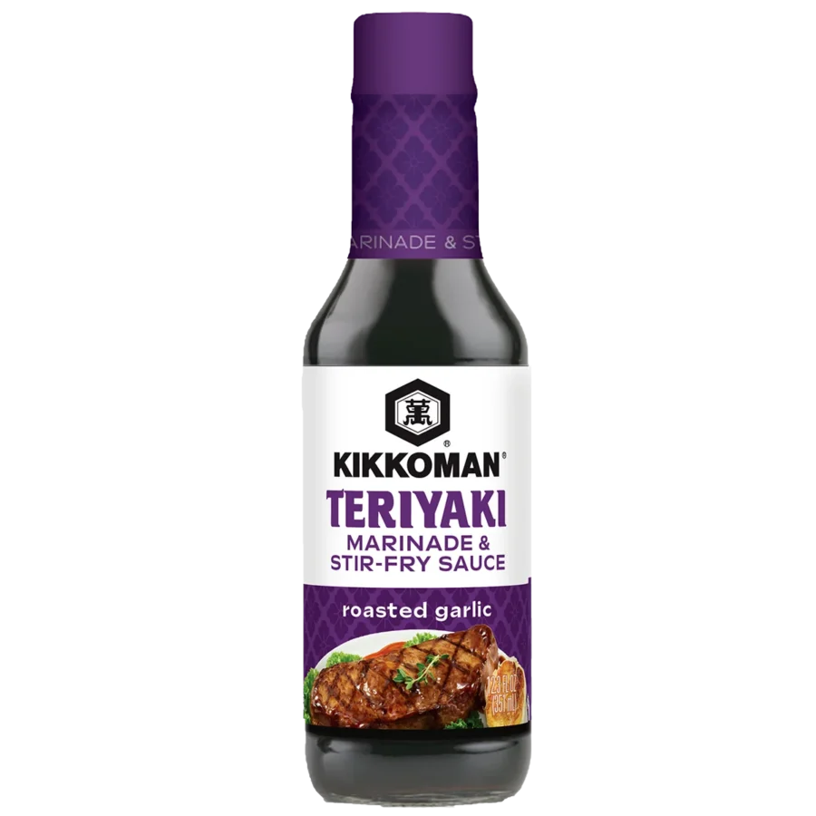 A bottle of Kikkoman Teriyaki Marinade & Stir-Fry Sauce, roasted garlic flavor, with an image of grilled meat on the label.