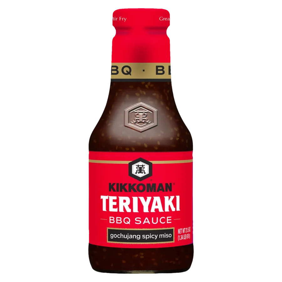 A bottle of Kikkoman Teriyaki BBQ Sauce with gochujang spicy miso, featuring a red and black label.
