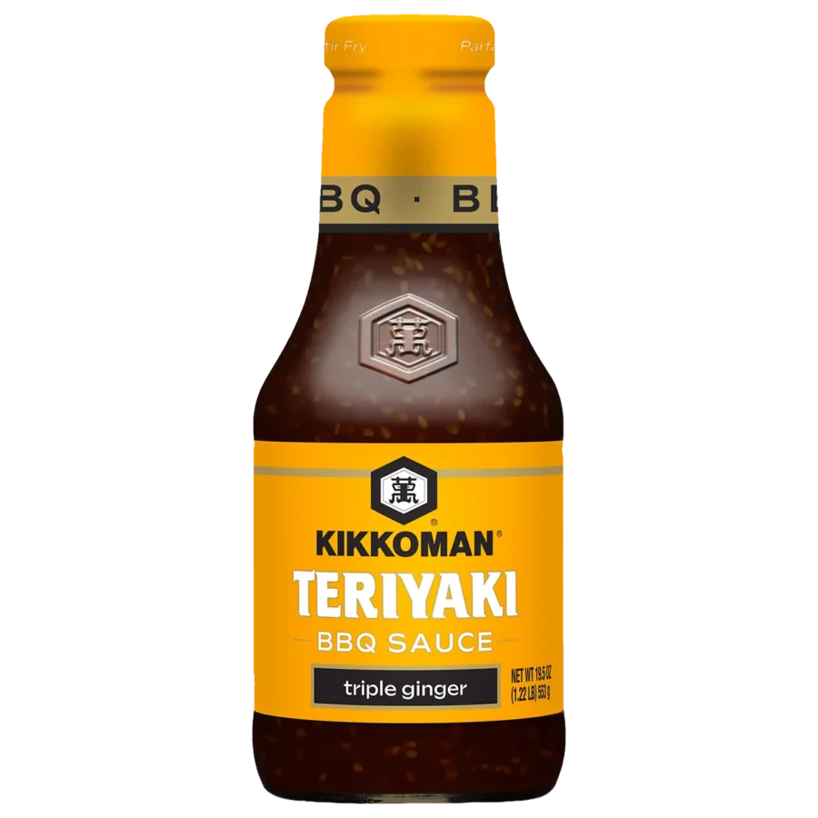 A bottle of Kikkoman Teriyaki BBQ Sauce, triple ginger flavor, with a yellow label and a silver cap.