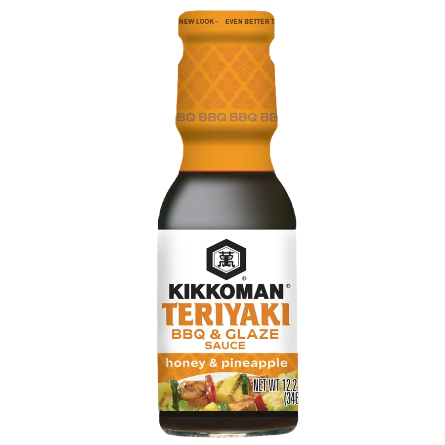 A bottle of Kikkoman Teriyaki BBQ & Glaze Sauce, honey & pineapple flavor, 12.2 oz, with a yellow cap and food images on the label.