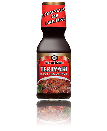 A bottle of Kikkoman Teriyaki Baste & Glaze with a red label, recommended for baking or grilling.