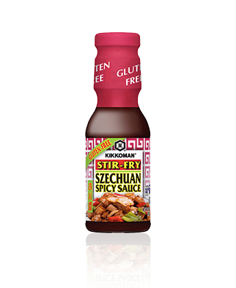 A bottle of Kikkoman Stir-Fry Szechuan Spicy Sauce labeled gluten free, with an image of a stir-fry dish on the front.