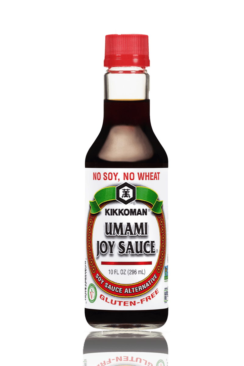 A 10 fl oz bottle of Kikkoman Umami Joy Sauce with a red cap, labeled as a soy sauce alternative that is gluten-free, contains no soy or wheat.