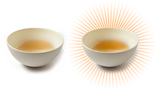 Two white bowls filled with tea; the bowl on the right is surrounded by radiant orange lines suggesting emphasis or significance.