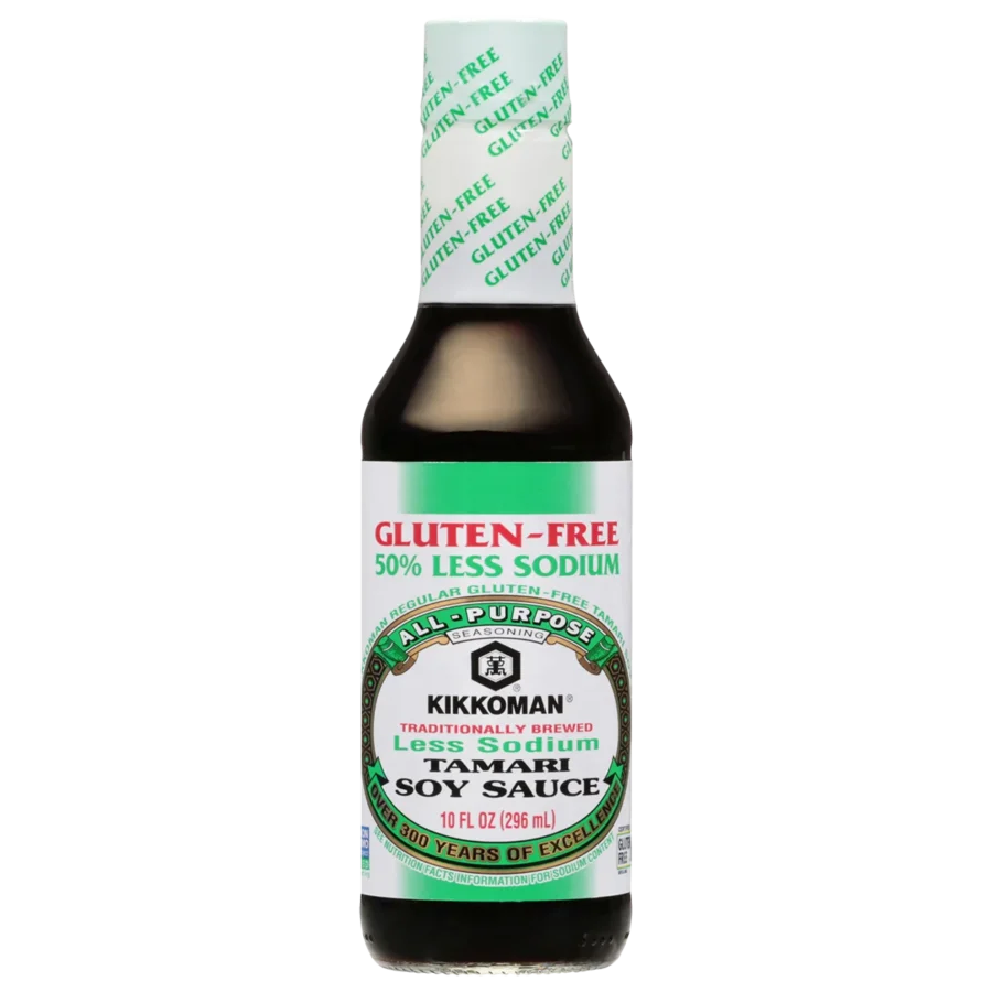 A bottle of Kikkoman Gluten-Free Less Sodium Tamari Soy Sauce, 10 fl oz, with a green and black label highlighting "50% less sodium.