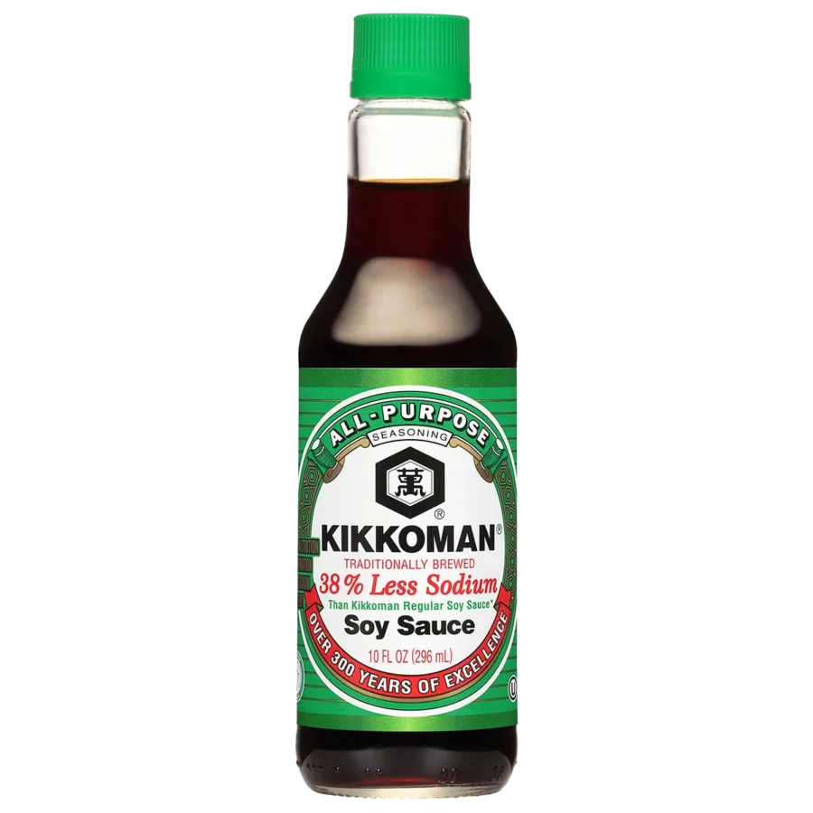 A 10 fl oz bottle of Kikkoman Less Sodium Soy Sauce with a green cap and label indicating 38% less sodium than regular soy sauce.