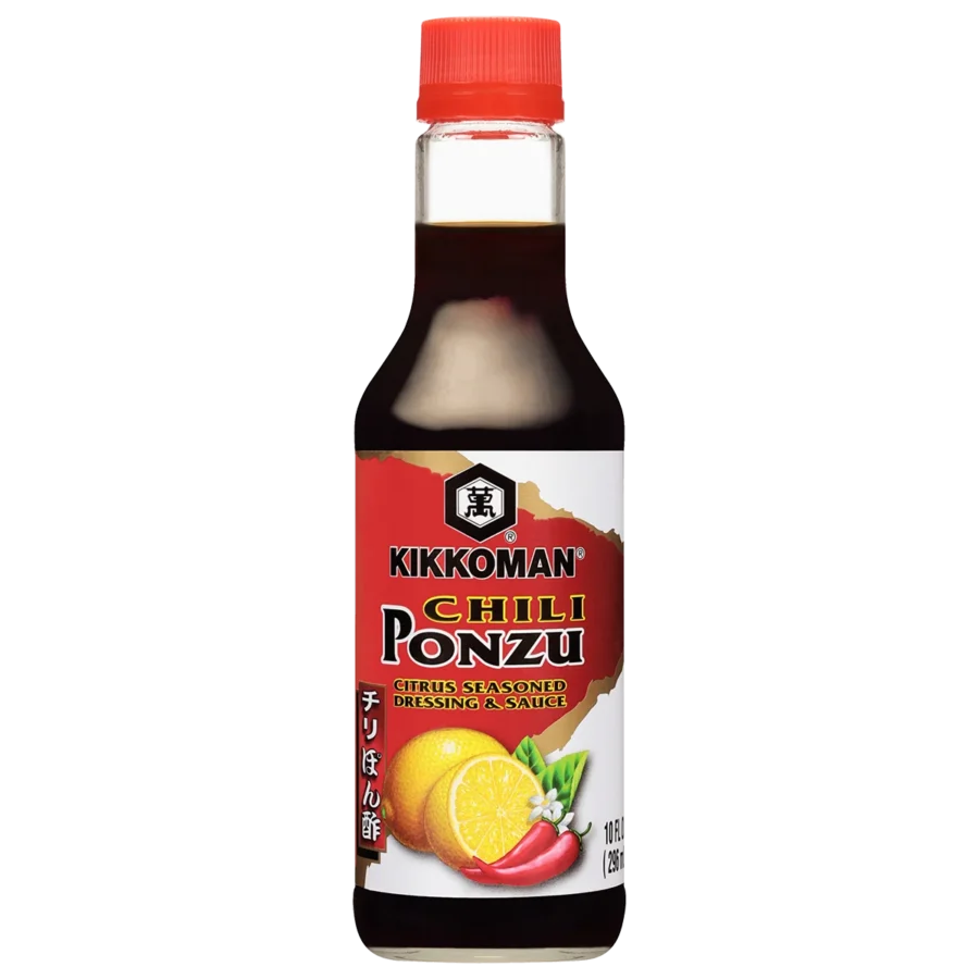 A bottle of Kikkoman Chilli Ponzu citrus seasoned dressing and sauce with images of lemon, chili peppers, and blossoms on the label.