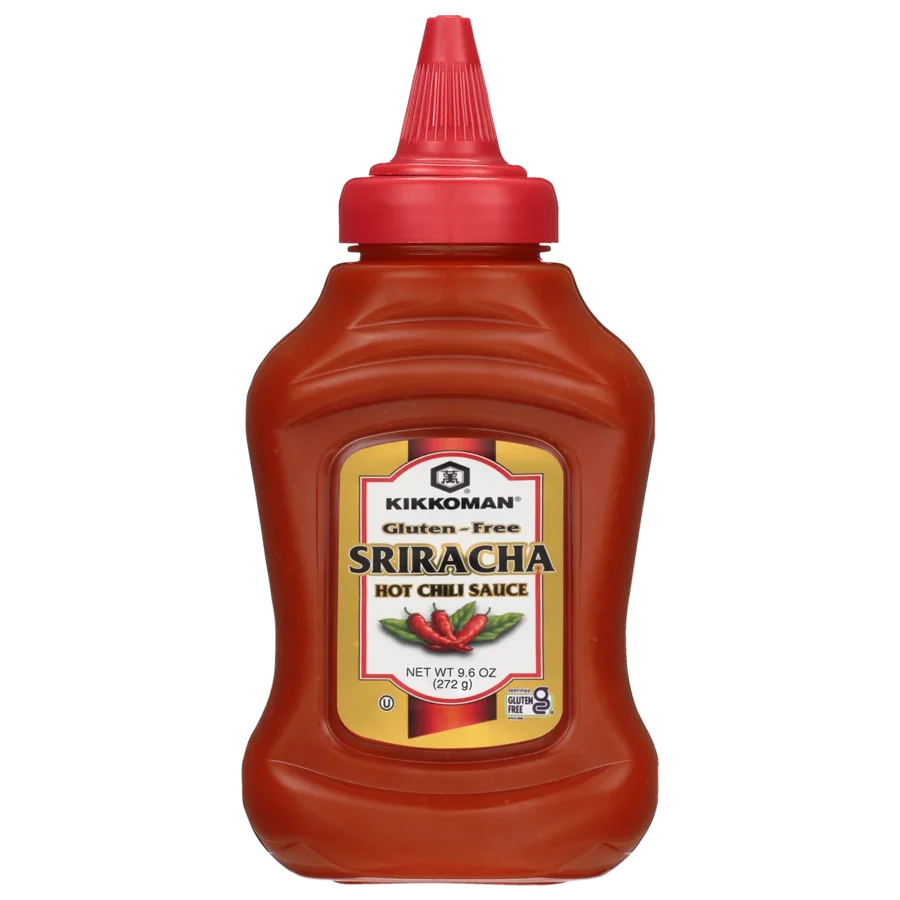 A plastic squeeze bottle of Kikkoman Gluten-Free Sriracha Hot Chili Sauce, 9.5 oz size, with a red cap and label featuring chili peppers.