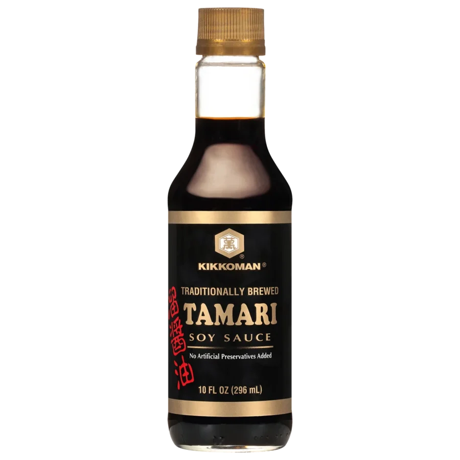A bottle of Kikkoman Tamari Soy Sauce, 10 fl oz (296 ml), with a black label and gold cap.