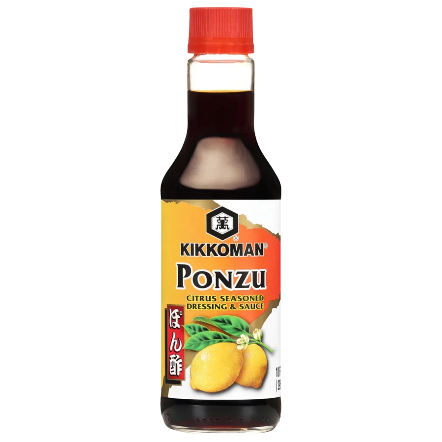 A bottle of Kikkoman Ponzu citrus seasoned dressing and sauce with a red cap and lemons illustrated on the label.