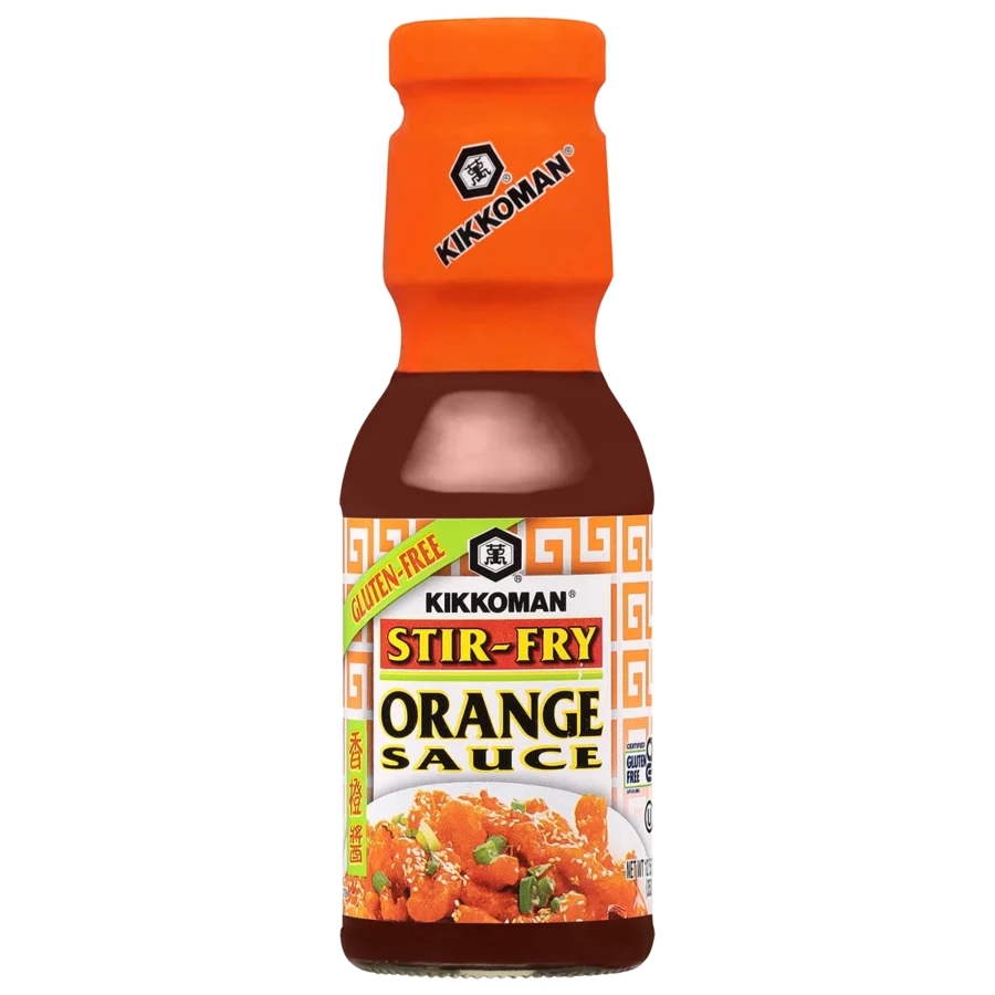 A bottle of Kikkoman Stir-Fry Orange Sauce labeled gluten-free, featuring an image of orange chicken on the front.