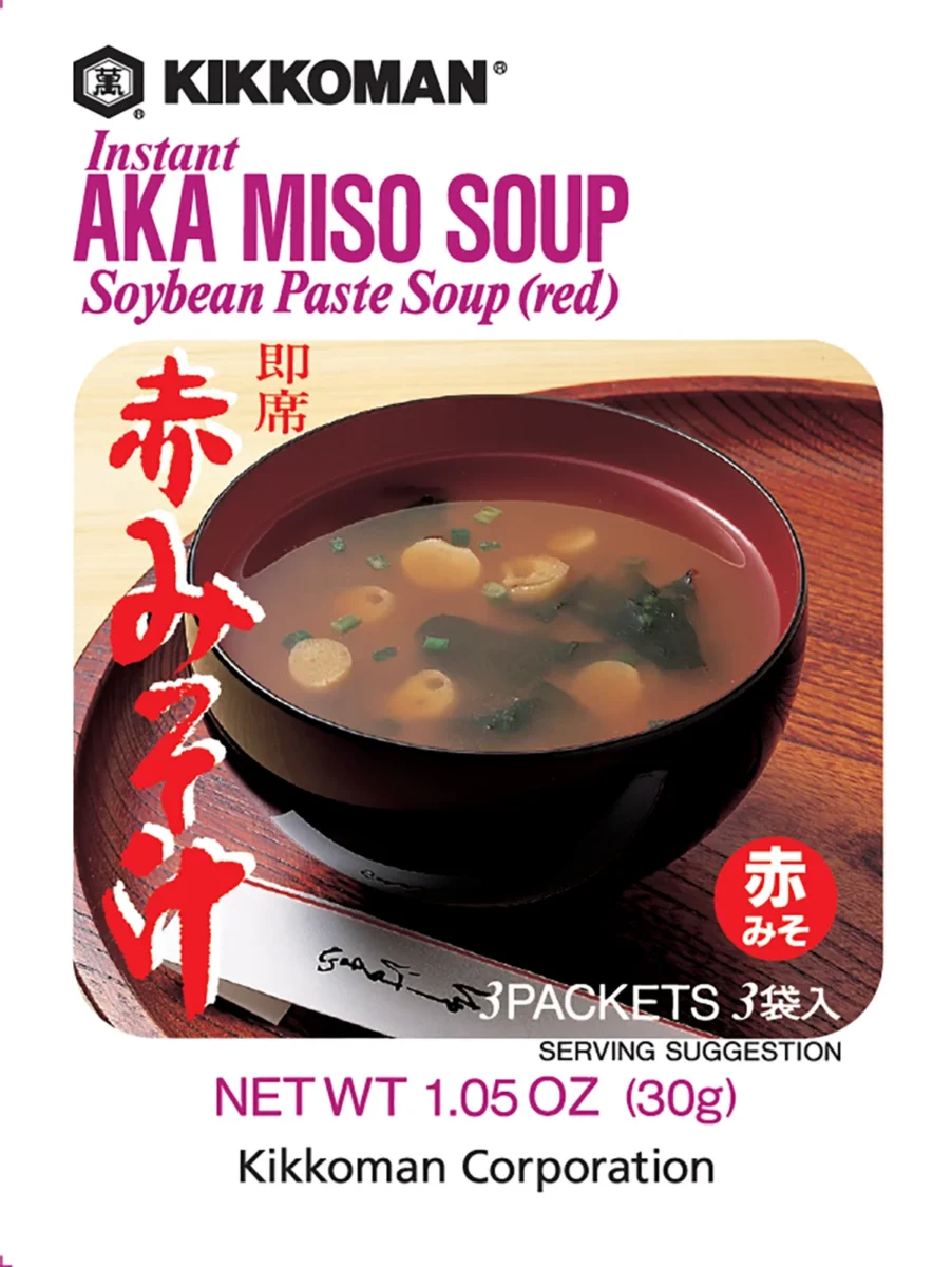 A packet of Kikkoman Instant Aka Miso Soup (red), showing a bowl of soup with tofu, seaweed, and green onions on the packaging.