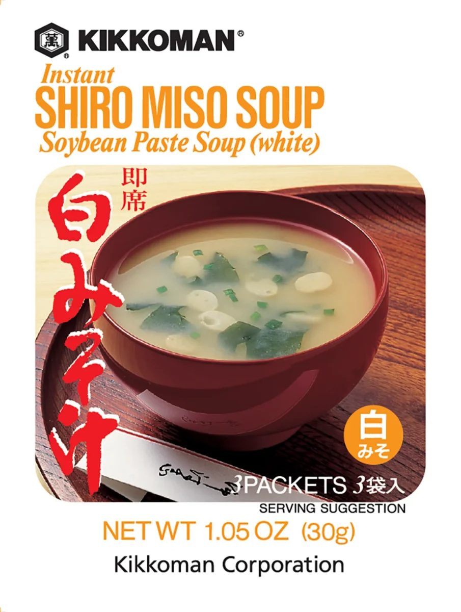 A box of Kikkoman Instant Shiro Miso Soup with an image of a bowl of miso soup, green onions, and tofu. Text includes product details and net weight of 1.05 oz (30g).
