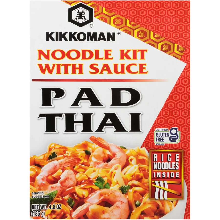 Front of a Kikkoman Pad Thai noodle kit box showing shrimp, noodles, and vegetables with text highlighting gluten-free rice noodles and included sauce.