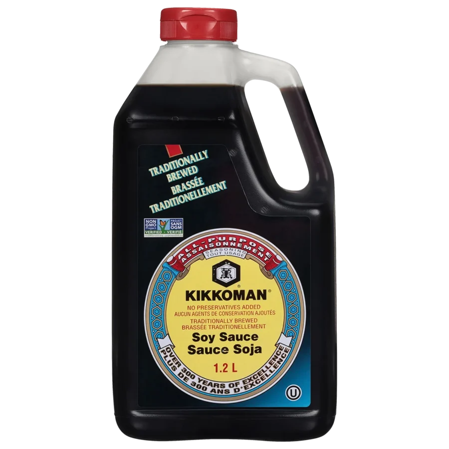 A 1.2-liter bottle of Kikkoman Soy Sauce with a handle, featuring a label in English and French stating it is traditionally brewed with no preservatives added.