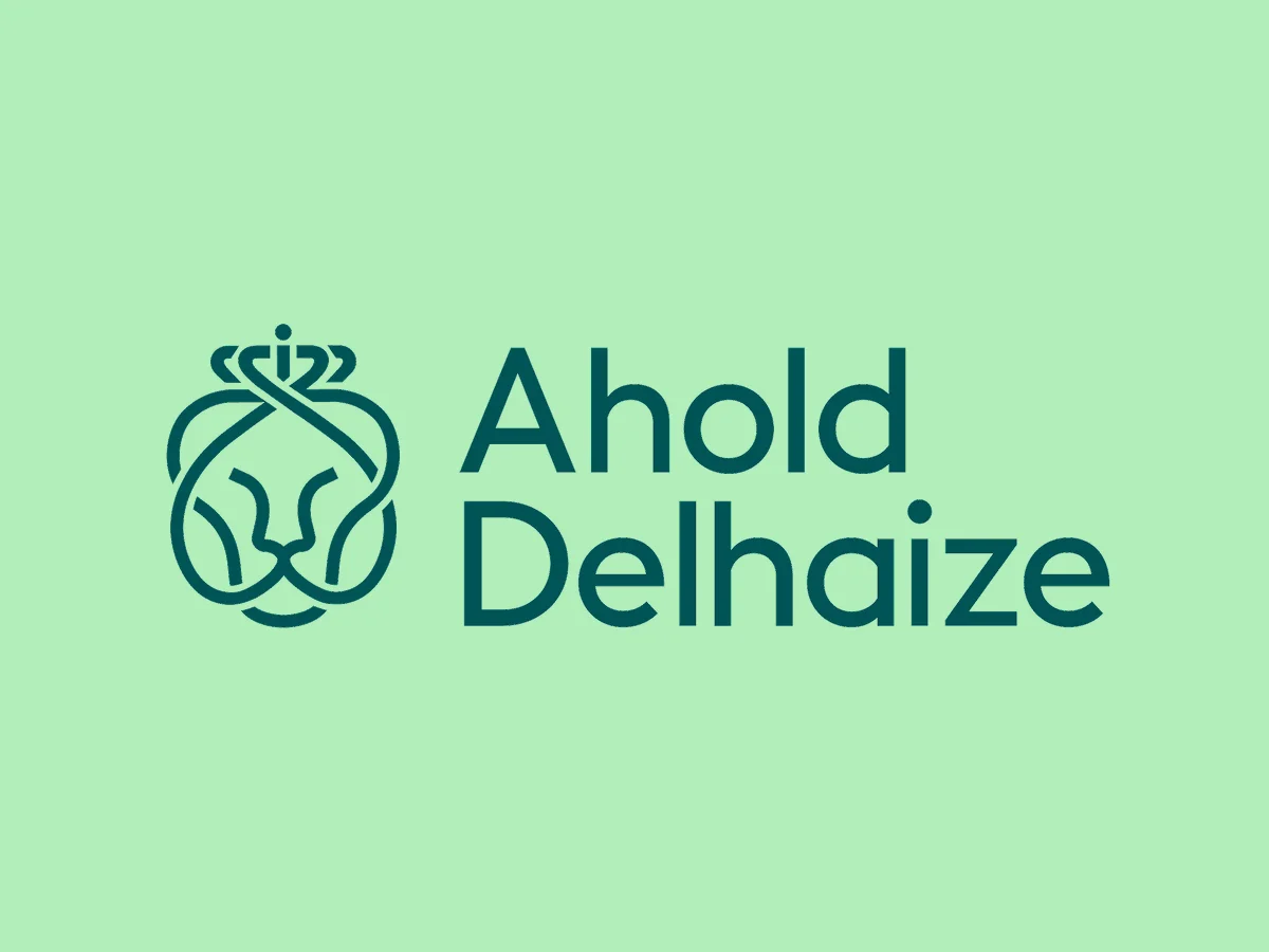 Ahold Delhaize logo featuring a stylized lion head with a crown and the company name in dark green text on a light green background.