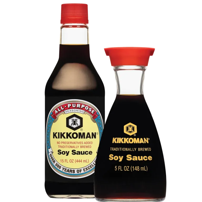 Two bottles of Kikkoman soy sauce, one with a red cap and yellow label (591 ml), the other with a red spout and yellow text (148 ml), side by side on a white background.